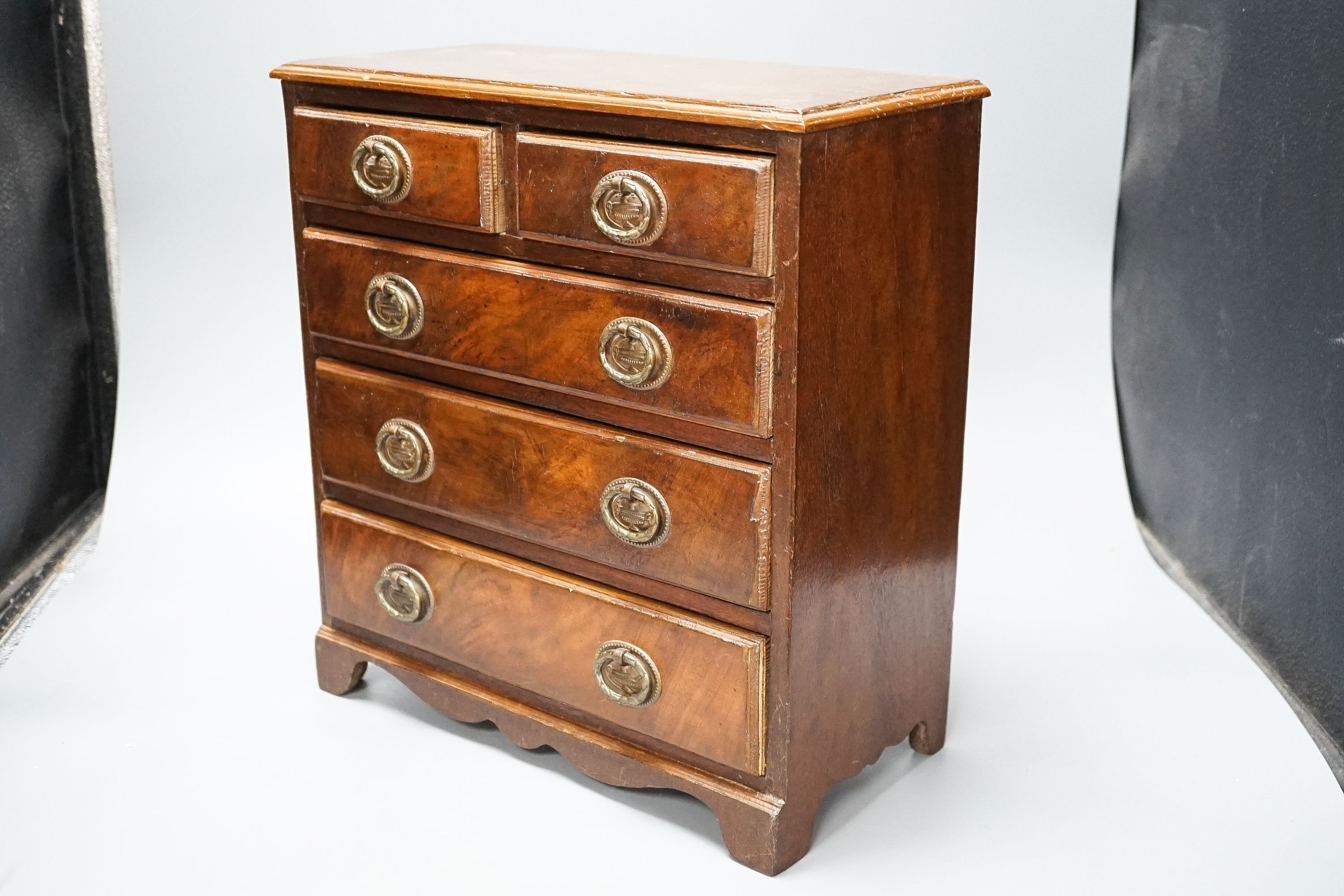 A 19th century mahogany miniature chest of drawers 35cm high, 33cm wide